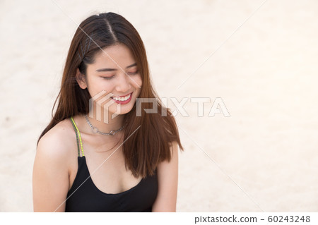 Asian beautiful woman enjoyful on the beach Asian beautiful woman enjoyful on the beach 60243248