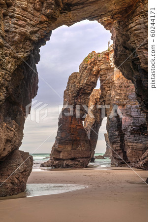 Natural stone archs on Playa de Las Catedrales, Spain 60244171