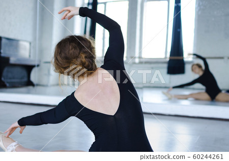 Ballet dancer. Train in the studio. Workout. 60244261