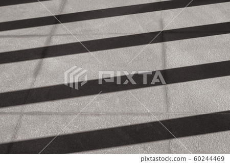 Abstract Black and White image of Light and shadow shading on concrete floor. Abstract Black and White image of Light and shadow shading on concrete floor. 60244469