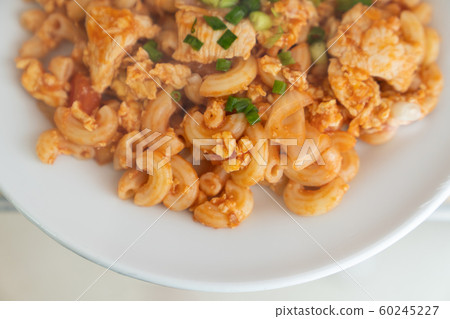 Close up macatoni tomato sauce on white dish. Close up macatoni tomato sauce on white dish. 60245227