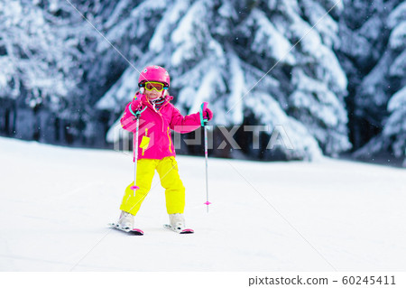 Ski and snow fun. Child in winter mountains. 60245411