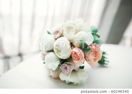 Beautiful wedding bouquet with different flowers, roses Beautiful wedding bouquet with different flowers, roses 60246540