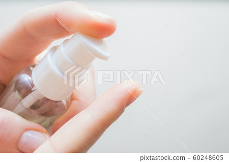 woman hands applying moisturizing cream to her finger skin from a tube. beautiful girl dropping collagen moisturizer serum into her hand at home woman hands applying moisturizing cream to her finger skin from a tube. beautiful girl dropping collagen moisturizer serum into her hand at home 60248605