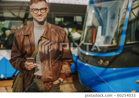 Handsome stylish man standing on the street Handsome stylish man standing on the street 60254033