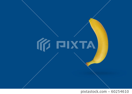 Yellow banana on a blue background with copy Yellow banana on a blue background with copy 60254610