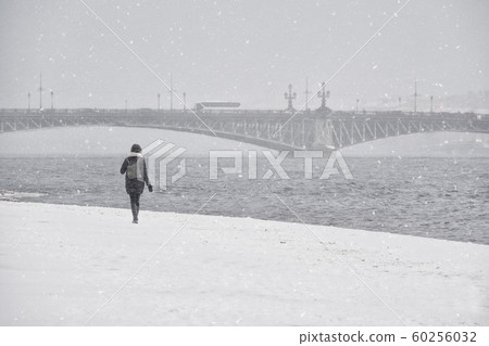 Woman under the snow in St. Petersburg. Russia.  Woman under the snow in St. Petersburg. Russia.  60256032