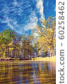 Small lake with several trees around in autumn 60258462