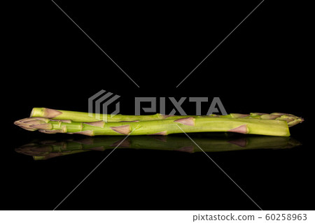 Healthy green asparagus isolated on black glass Healthy green asparagus isolated on black glass 60258963