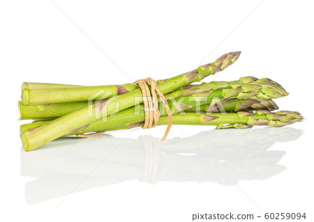 Healthy green asparagus isolated on white Healthy green asparagus isolated on white 60259094