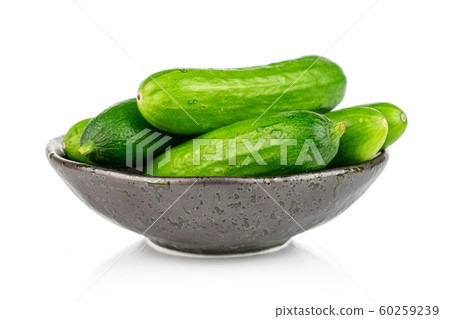 Fresh green baby cucumber isolated on white Fresh green baby cucumber isolated on white 60259239