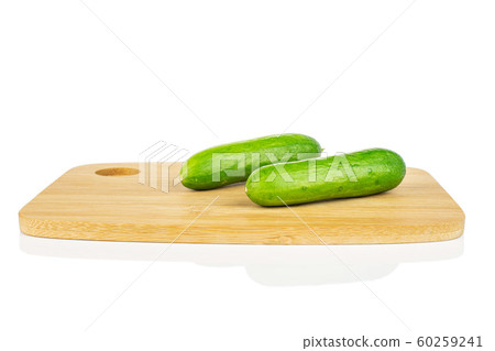 Fresh green baby cucumber isolated on white Fresh green baby cucumber isolated on white 60259241