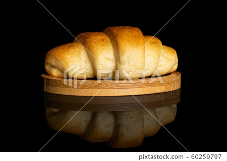 Sweet mini croissant isolated on black glass Sweet mini croissant isolated on black glass 60259797