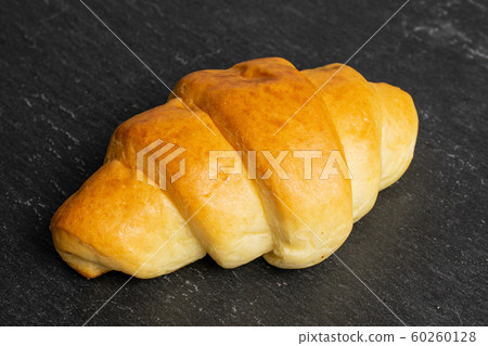 Sweet mini croissant on grey stone Sweet mini croissant on grey stone 60260128