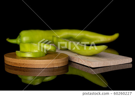 Hot green pepper isolated on black glass Hot green pepper isolated on black glass 60260227
