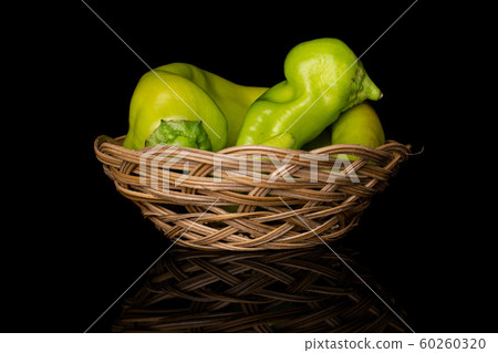 Hot green pepper isolated on black glass 60260320