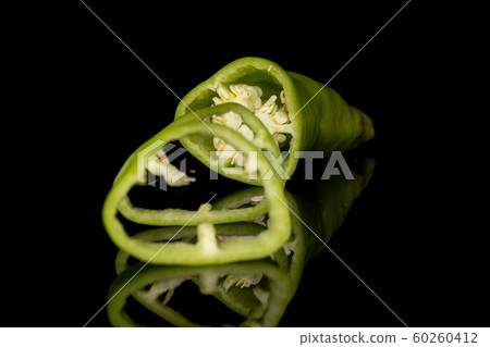 Hot green pepper isolated on black glass Hot green pepper isolated on black glass 60260412