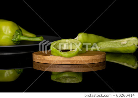 Hot green pepper isolated on black glass Hot green pepper isolated on black glass 60260414
