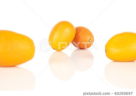 Tasty orange kumquat isolated on white Tasty orange kumquat isolated on white 60260697