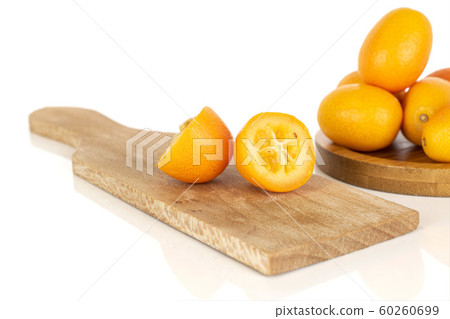 Tasty orange kumquat isolated on white Tasty orange kumquat isolated on white 60260699