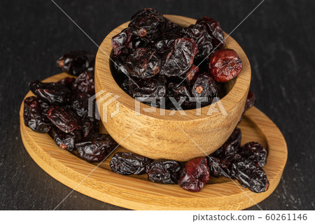 Dried cowberry on grey stone Dried cowberry on grey stone 60261146