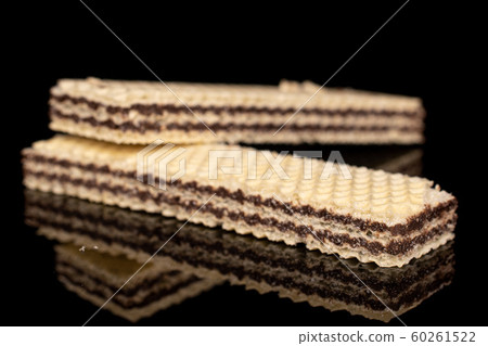 Chocolate biscuit wafer isolated on black glass Chocolate biscuit wafer isolated on black glass 60261522