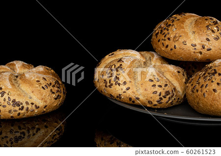 Sesame kaiser roll isolated on black glass Sesame kaiser roll isolated on black glass 60261523