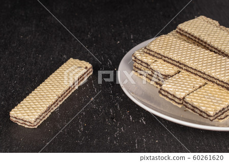 Chocolate biscuit wafer on grey stone Chocolate biscuit wafer on grey stone 60261620