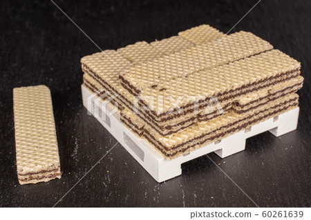 Chocolate biscuit wafer on grey stone Chocolate biscuit wafer on grey stone 60261639