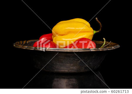 Hot chili habanero isolated on black glass 60261713