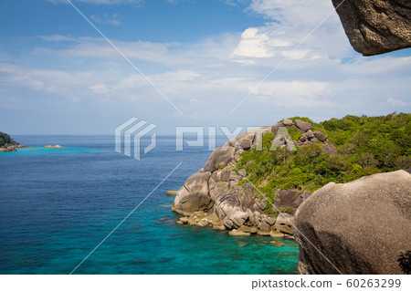 Tropical view of sea with islands. Sunny day, blue sky. Transparent azure water. 60263299