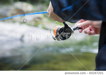Mountain stream fishing image Male hand 60267201
