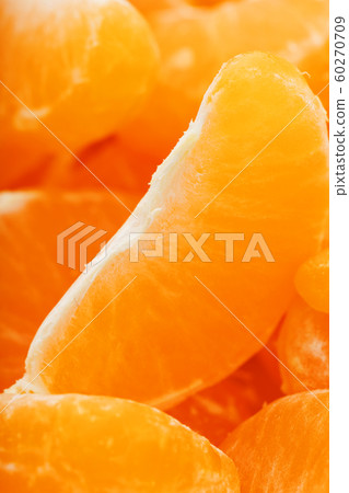 Slices of juicy tangerines close up as background Slices of juicy tangerines close up as background 60270709
