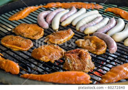 Barbecue grill bbq on coal charcoal grill with steaks bratwurst sausages and meat delicious summer meal Barbecue grill bbq on coal charcoal grill with steaks bratwurst sausages and meat delicious summer meal 60272840