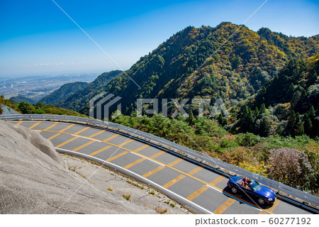 A blue open car that passes the Suzuka Skyline in Mie Prefecture 60277192