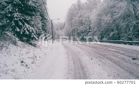 Image of a road and trees with snow. Image of a road and trees with snow. 60277701