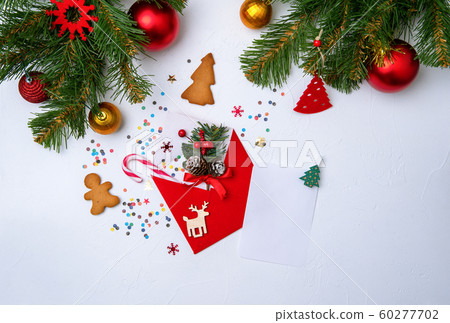 Photo of red envelope, cookies, branches of spruce Christmas decorations. Photo of red envelope, cookies, branches of spruce Christmas decorations. 60277702