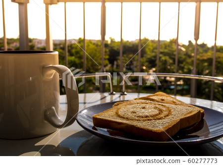 Breakfast with morning light at the balcony 60277773