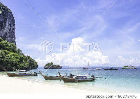 Lots of boat tours and tourists on the beach at Poda island , Krabi in Thailand. 60278476