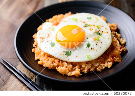 Kimchi fried rice with fried egg on top, Korean food Kimchi fried rice with fried egg on top, Korean food 60280072