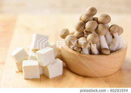 Sliced tofu and shimeji mushroom in bowl  60281934