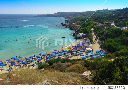 People at the famous beach of Konnos Bay Beach, Ayia Napa. Famagusta District, Cyprus. Best beaches of Cyprus - Konnos Bay in Cape Greko national park 60282220