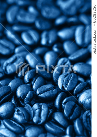 Roasted dark coffee beans background. Close up. Roasted dark coffee beans background. Close up. 60282256