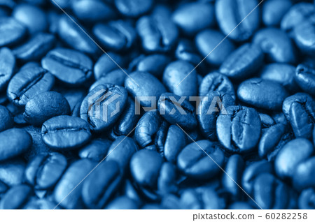 Roasted dark coffee beans background. Close up. Roasted dark coffee beans background. Close up. 60282258