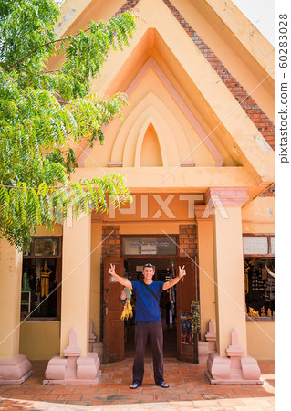 the man stand on the enter of museum in 60283028