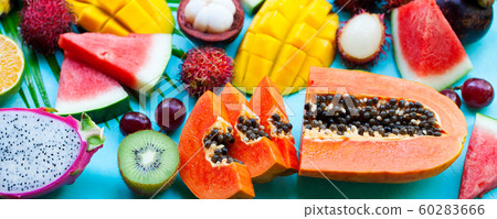 Assortment of tropical exotic fruits. Blue background. Top view. 60283666