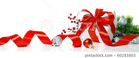 Christmas gift with red bow, ball and tree on Christmas gift with red bow, ball and tree on 60283803
