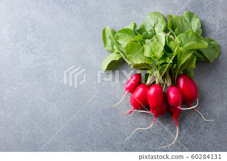 Radish bunch on grey stone background. Copy space. Top view. 60284131