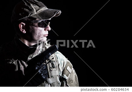 Portrait of army soldier armed service pistol 60284634