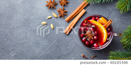 Mulled red wine with spices. Christmas decoration. Grey background. Copy space. Top view. 60285306